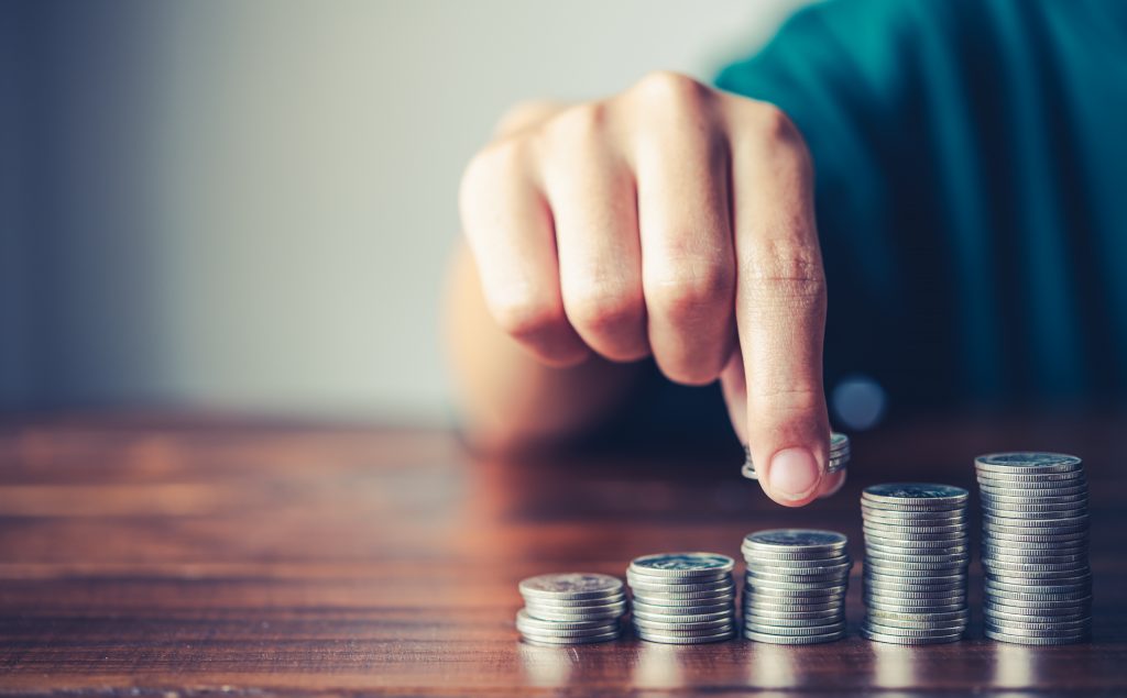 Hand putting money coin on each line rising - business saving money concept for finance accounting Axis Health System billing options include a sliding-fee scale.